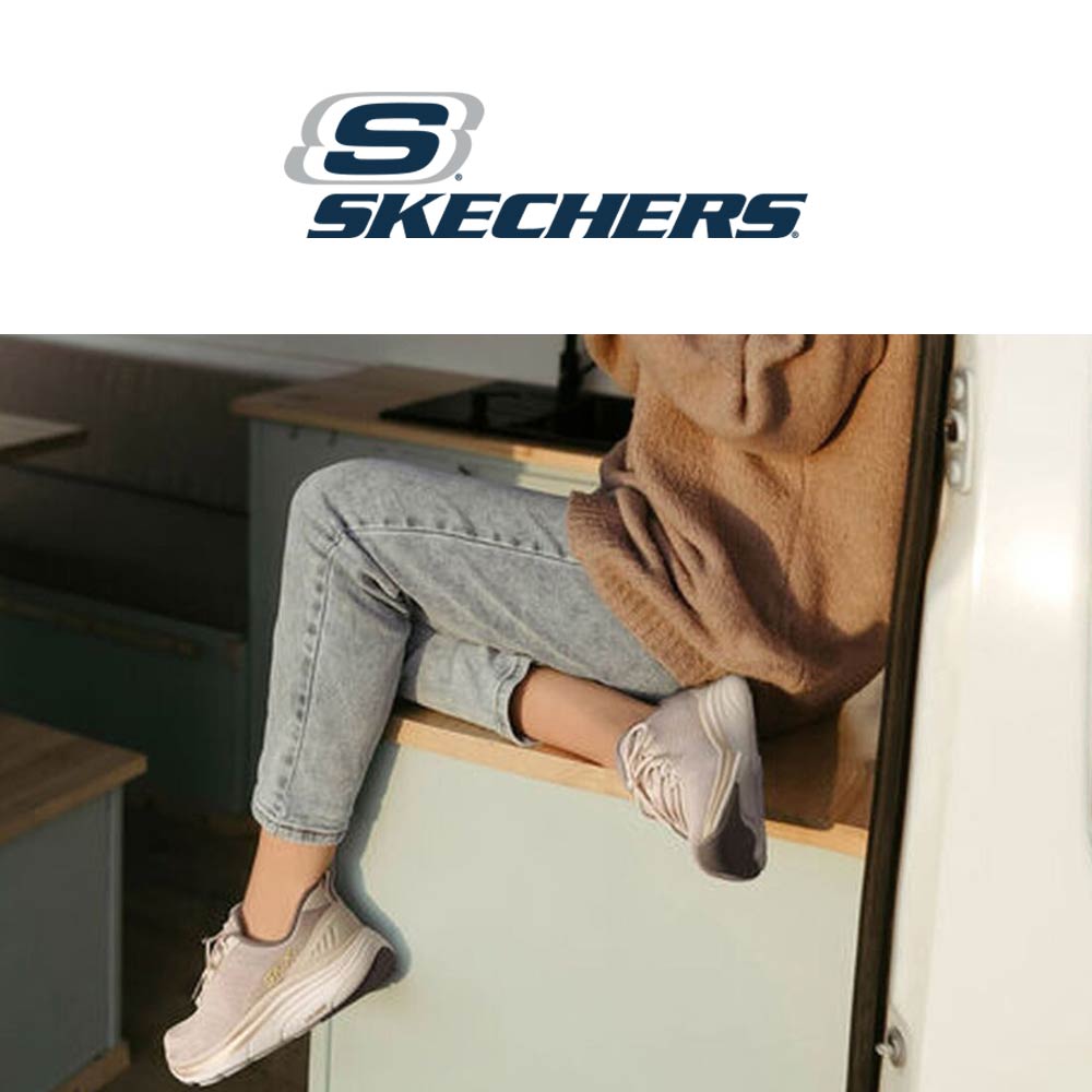skechers lifestyle image woman sitting with trainers